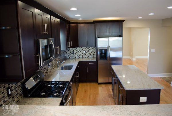 dark brown espresso corner kitchen with backsplash