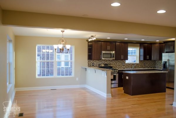 brown espresso corner kitchen with backsplash