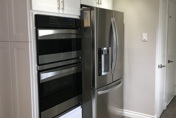 fashion white chic kitchen cabinets around fridge