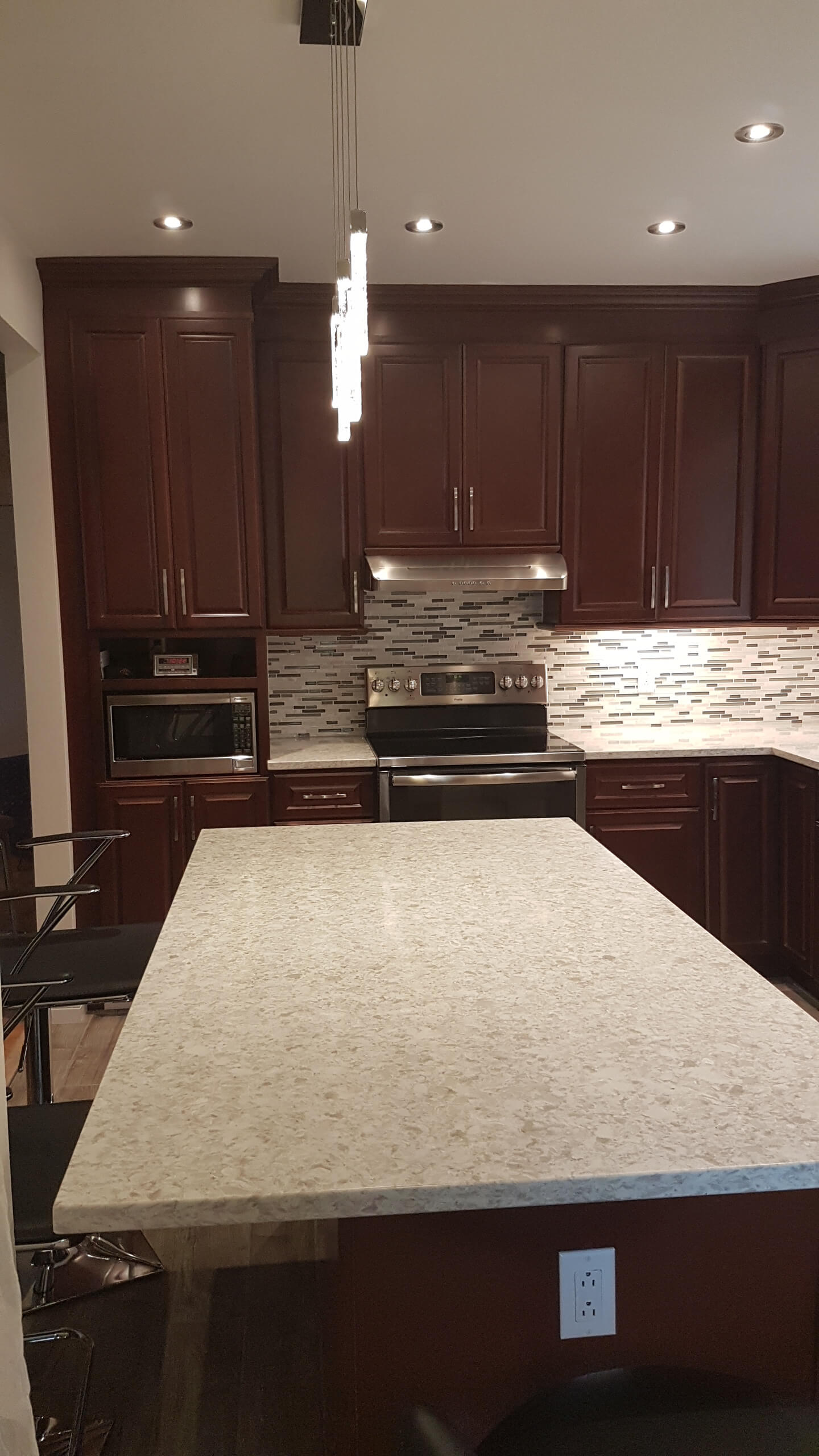 quincy cherry custom cabinets and quartz countertop