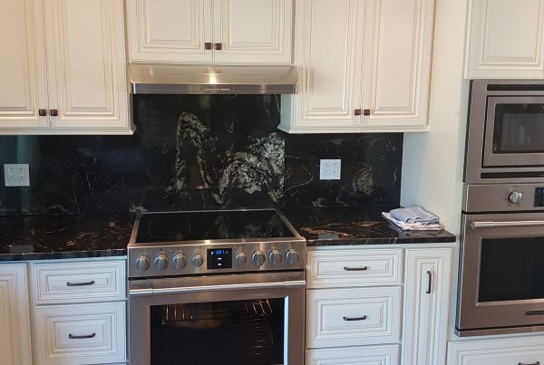 wheaton white kitchen cabinets and black marble backsplash